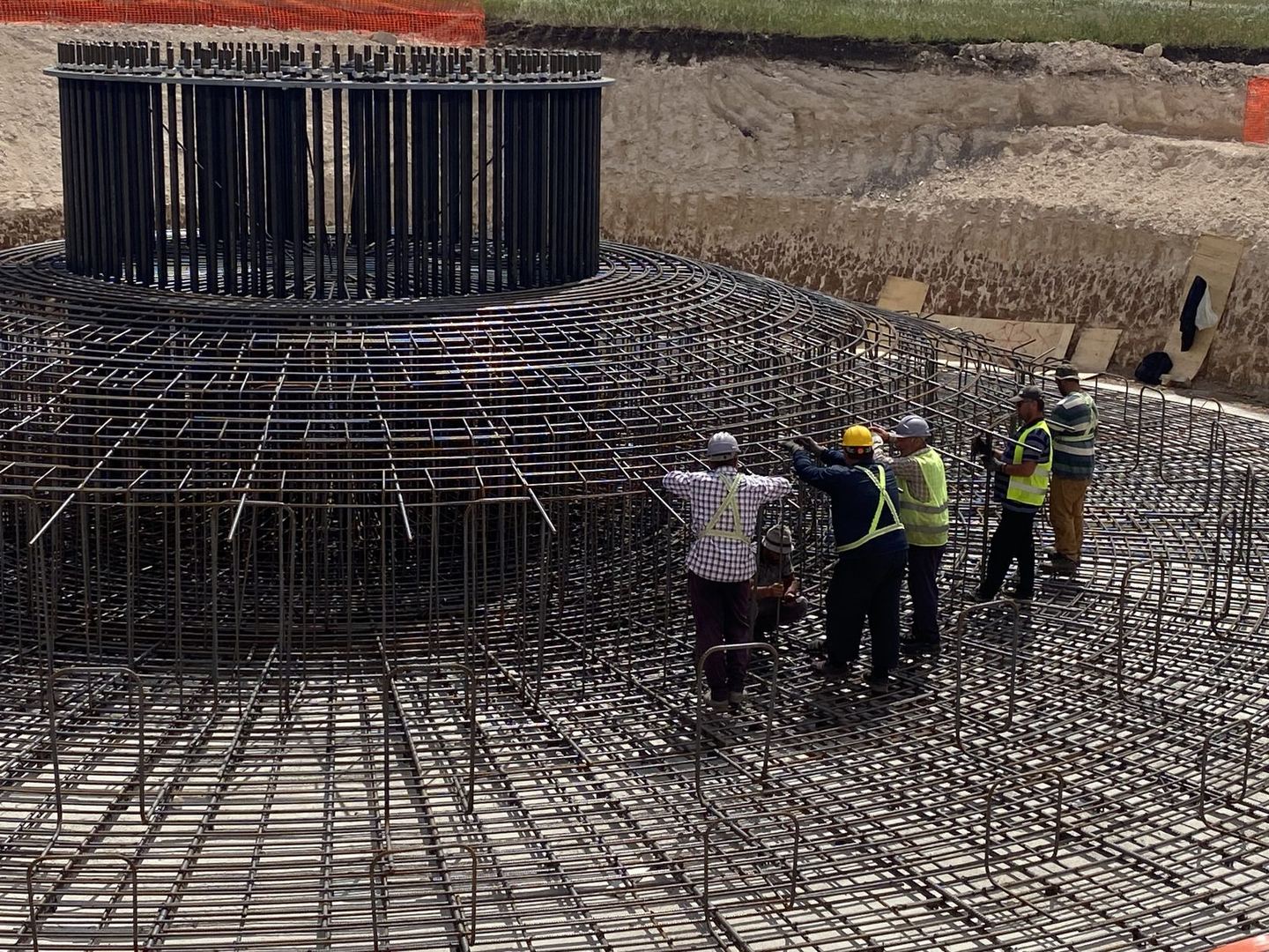 Engineering team working on wind turbine foundation rebar